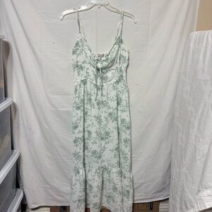 Ivory green floral ruffle trim midi dress with a floral print, smocked waist,